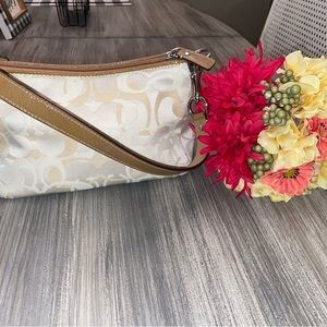 Coach Signature Beige/Tan Leather Trim Zoe Handle/Small Style. Small pen mark.